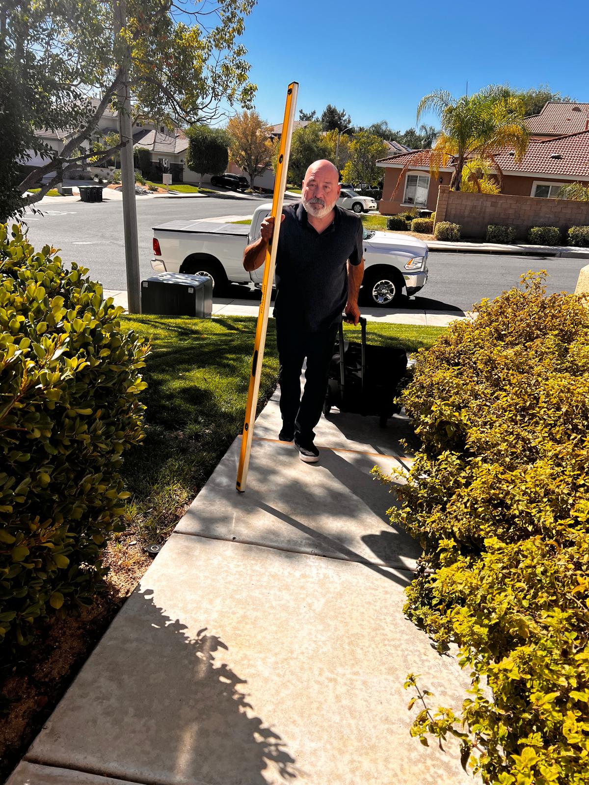 Nick Perez arriving at an inspection with his level and gear