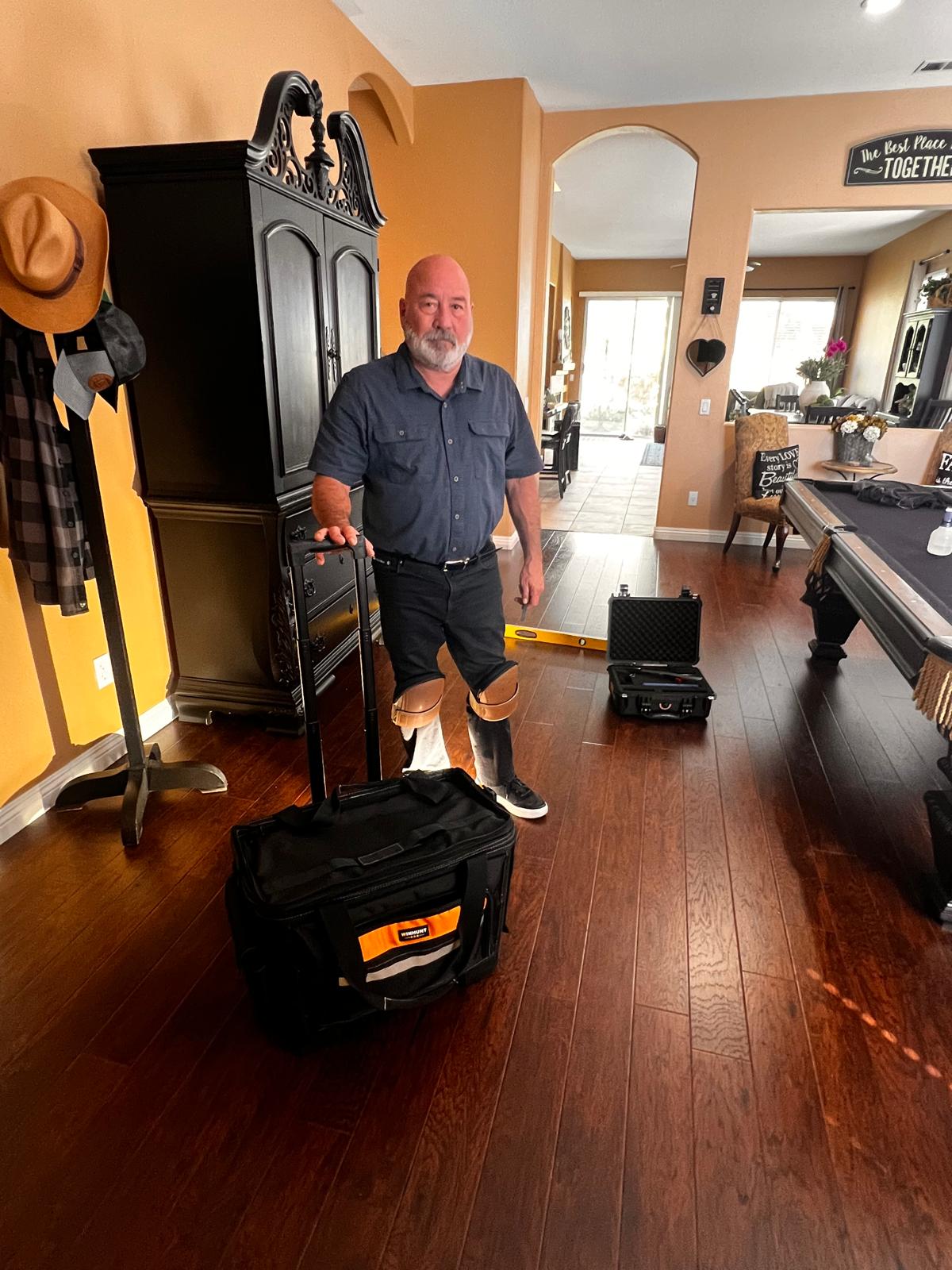 Nick Perez, independent certified flooring inspector, with his inspection gear on site